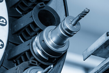 Close up scene the bull nose end mill tool installed at the tool magazine in the light blue scene.