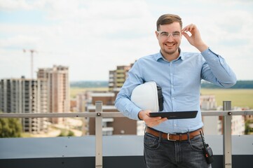 Businessman standing in building in construction process