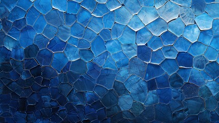 A textured pattern of overlapping blue circular shapes, resembling cracked surfaces