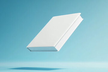 A white hardcover book floating against a blue background, representing knowledge, minimalism, and creative design concepts.
