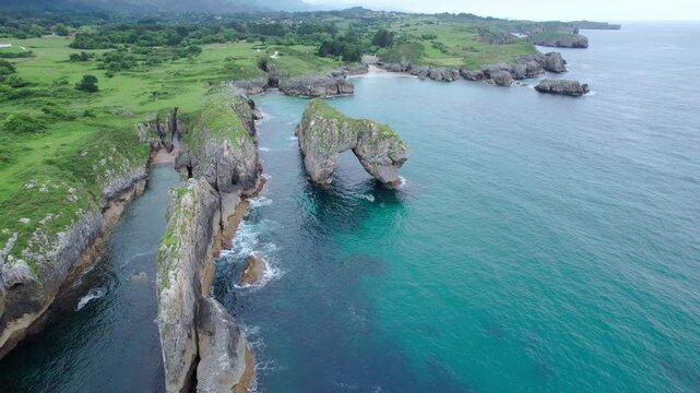The natural archway of "El castro de les gaviotas" in Asturias, Spain 