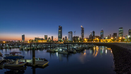 Obraz premium Yachts and boats at the Sharq Marina night to day timelapse in Kuwait. Kuwait City, Middle East