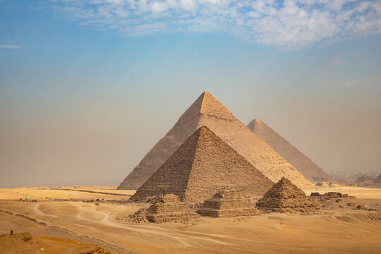 Egypt. Cairo - Giza. General view of pyramids from the Giza Plateau (three pyramids known as Queens' Pyramids on front side; next in order from left: the Pyramid of Menkaure, Khafre and Chufu