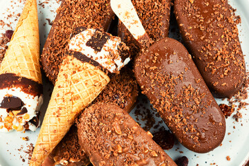 Assorted ice creams on stick.