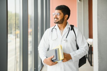 multiracial South Asian medical students with a medical court and stethoscope. medical student life
