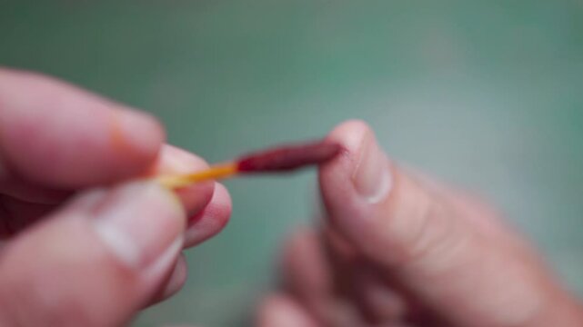 the wound on the finger is treated with iodine solution on a cotton swa