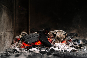 glowing charcoal in stone bbq