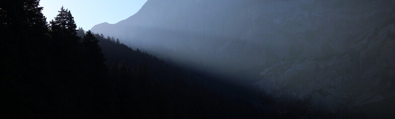 Fototapeta premium Morning Light Shining Into A Mountain Valley