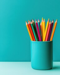 Colorful pencils in a turquoise holder, perfect for creative projects and art activities, adding vibrancy to any workspace.