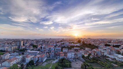Fototapeta premium Rooftops of Porto's old town on a warm spring day timelapse during sunset, Porto, Portugal