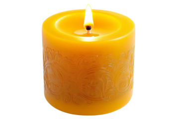 A single yellow candle with an intricate design is lit against a white transparent background.
