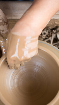 Pottery art in process on a potters wheel