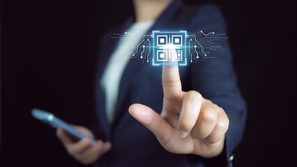 Qr code payment, E wallet , cashless technology concept.QR code scan for website or mobile application customer support, digital payment.Businessman showing QR code icon on virtual screen.
