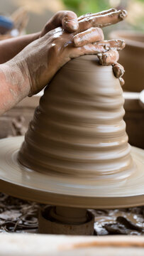 Pottery art in process on a potters wheel