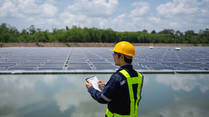Engineer setting up floating solar panels on a platform in the lake. Worker is on-site, installing and maintaining the floating solar panel system on the water.
