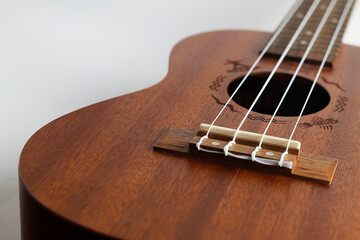 acoustic Ukulele Hawaiian Guitar. a wooden ukulele with strings. Instrument Hawaii ukulele made of...