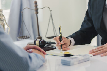 Lawyer accepts bribe in office, concept of corruption and bribery of lawyer with legal documents, scales of justice and hammer