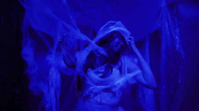 Ghost or zombie in an abandoned haunted house at night. Halloween festival concept,Ghost movies with blue light