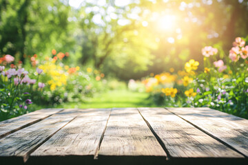 Rustic wooden table in a sunny garden with bright flowers and greenery creating a warm and inviting natural setting