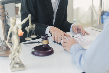 Lawyer accepts bribe in office, concept of corruption and bribery of lawyer with legal documents, scales of justice and hammer