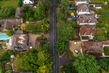 Aerial drone shot over cars driving on the road in Bishops Stortford in England