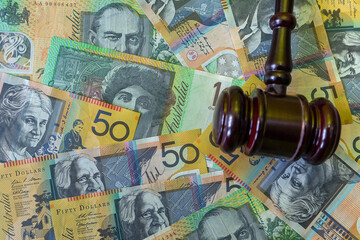 judge hammer with australian dollar money on desk.  Crime corruption concept a