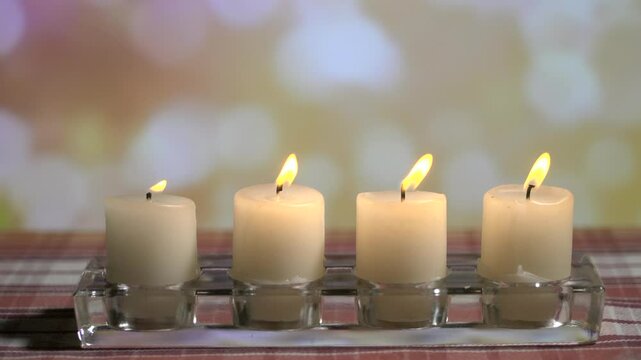 Four Christmas candles on a festive background. Fourth Advent. Christmas.