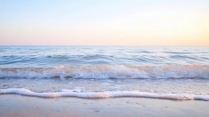 Fototapeta premium The tranquil seascape features calm waves and a soft horizon, creating a serene coastal scene in nature's peaceful landscape.