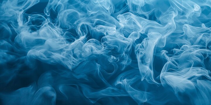 White smoke curls against a blue background, forming abstract shapes and creating a dreamy and ethereal visual effect.