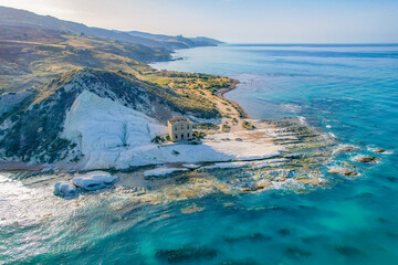 Punta Bianca, near Agrigento in Sicily Italy. Beach with ruins of an stone house on white cliffs.