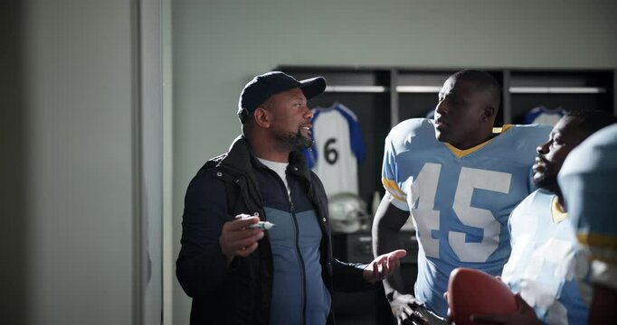 Men, coach and strategy on whiteboard as American football player for ideas and planning on half time. People, sports and smile in changing room for tournament, match and game as club with teamwork