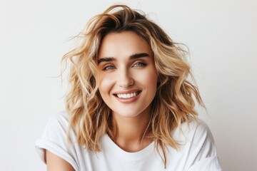 Fototapeta premium Long-haired blonde beams for camera in portrait, captivating smile, feminine allure, attractive face.