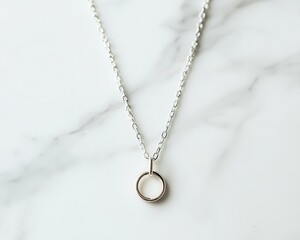 Fototapeta premium A single gold pendant necklace on a white marble surface, minimalist, high contrast, soft natural light