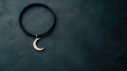 A thin choker with a minimalist moon charm, black and silver, high contrast, dark background