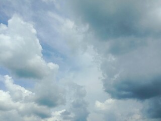 A clear blue sky with a few clouds. The sky is so clear that it almost looks like a painting