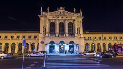 Obraz premium People on the Tomislav Square in front of Main Railway Station night timelapse hyperlapse. ZAGREB, CROATIA