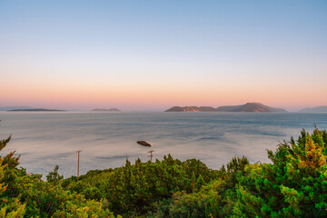 Lighthouse on the cliff. Seascape of Cape Lefkatas with old lighthouse on Lefkada island, Greece. Beautiful views of azure sea water and nature with cliffs