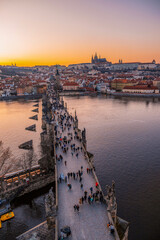 Naklejka premium View of the city of Prague castle in hradcany and the Vltava river with Charles bridge from Old Town Bridge Tower in Prague, Czech Republic.