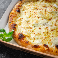 pizza four types of cheese mozzarella, blue cheese, camembert and cheddar fresh meal food snack on the table copy space food background rustic top view