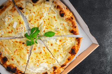 pizza four types of cheese mozzarella, blue cheese, camembert and cheddar fresh meal food snack on the table copy space food background rustic top view