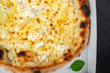 pizza four types of cheese mozzarella, blue cheese, camembert and cheddar fresh meal food snack on the table copy space food background rustic top view