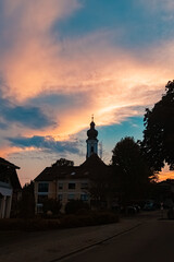 Sunset with a church silhouette at Neuhausen, Offenberg, Deggendorf, Bavaria, Germany