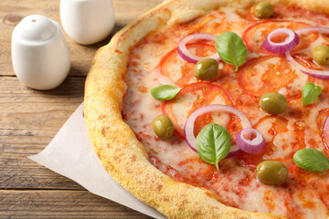 Delicious vegetarian pizza on wooden table, closeup