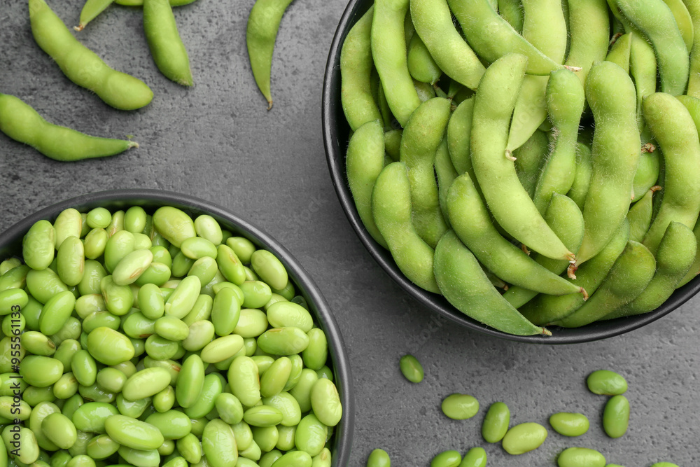 Sticker Raw green edamame soybeans and pods on grey table, top view