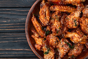 Caramelized in sause chicken wings  . Bar-b-q food background photo