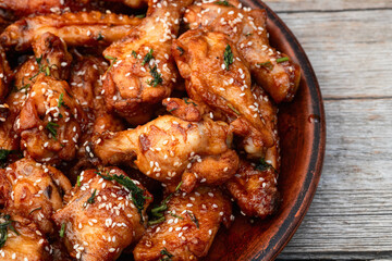 Caramelized in sause chicken wings  . Bar-b-q food background photo