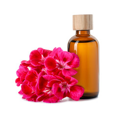 Geranium essential oil in bottle and beautiful flowers isolated on white