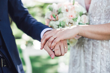 bride and groom holding hands