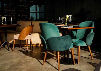 Stylish table setting in a cozy restaurant with dishes and furniture.in a minimalist style