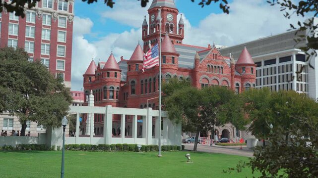 US Flag and Dealey Plaza in Dallas Texas